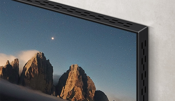 Крупний план кута телевізора з екраном Infinity Screen, який має мінімалістичний вигляд із тонкою зменшеною рамкою.