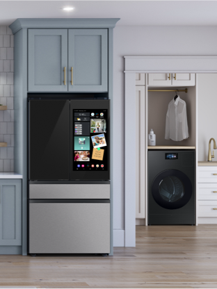 Bespoke appliances in Stainless Steel and Dark Steel in a kitchen with blue cabinets and laundry room with white cabinets